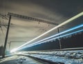 Light trail from the train while moving at night in winter Royalty Free Stock Photo