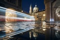 Light trail of tram passing between historic buildings Royalty Free Stock Photo