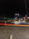 Light trail of vehicle lights at night in crossroads