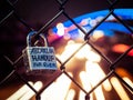 Lock on Chain Fence at Night with Light Trails