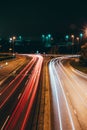 light trails of cars at night approaching a roundabout Royalty Free Stock Photo