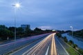 Light trails of cars speeding on a British Motorway before dawn Royalty Free Stock Photo