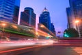 Light trails on a city street at dusk Royalty Free Stock Photo