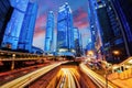 Light trails of fast moving traffic during evening sunset rush hour in downtown Hong Kong Royalty Free Stock Photo