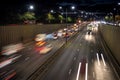 Light trails from speeding cars on the A40 highway in Perivale, London, UK, during the early evening Royalty Free Stock Photo