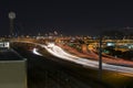 Light trails on highway I-35 in Dallas with Reunion Tower Royalty Free Stock Photo