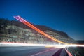 Light trails at night in the mountains from outgoing traffic