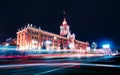 Light trails of passing cars in front of Yekaterinburg city hall at night Royalty Free Stock Photo