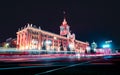 Light trails of passing cars in front of Yekaterinburg city hall at night Royalty Free Stock Photo