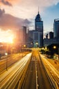 Light trails of traffic in Hong Kong at sunset time with Hong Kong bussines center in background. Asia. Asian tourism, modern city Royalty Free Stock Photo