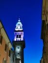 Light up medieval tower against blue night sky Royalty Free Stock Photo