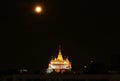 Light-up Phu Khao Thong Stupa of Wat Saket Temple on the Amazing Full Moon Night, Bangkok, Thailand Royalty Free Stock Photo