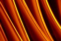 Light wave trail path, vibrant neon gold color in abstract swirls on a black background Royalty Free Stock Photo