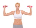 Light weights are for toning. Portrait of a young woman working out with dumbbells. Royalty Free Stock Photo