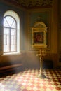 Light from the window on the icon and burning candles in the Church Royalty Free Stock Photo