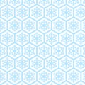 Light winter seamless pattern with sky blue snowflakes on soft sand hexagonal tiles. Royalty Free Stock Photo