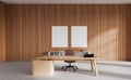 Light wooden CEO office with posters Royalty Free Stock Photo