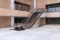 Light wooden and concrete empty shopping mall interior with escalator. Large public interiors concept.