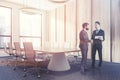 Light wooden meeting room corner, people Royalty Free Stock Photo