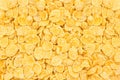 Light yellow corn flakes texture as a background. Top view cereal box for morning breakfast close up. Royalty Free Stock Photo