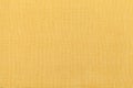 Light yellow ocher background from a textile material. Fabric with natural texture. Backdrop. Royalty Free Stock Photo