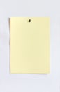 Light yellow sheet attached with pushpin