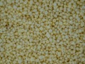 Light yellow small round granules are chemical fertilizers calcium nitrate Royalty Free Stock Photo