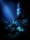 Lightbeams illuminate diver in the flooded underground cavern at Devil's Den, Williston Florida Royalty Free Stock Photo