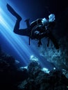 Lightbeams illuminate diver in the flooded underground cavern at Devil's Den, Williston Florida Royalty Free Stock Photo