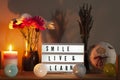 Lightbox, flowers, candle and home decorations with inspirational message