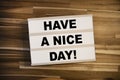 Lightbox or light box with message Have a nice day on a wooden table Royalty Free Stock Photo