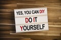 Lightbox or light box with yes you can diy - do it yourself on a wooden table background