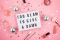 Lightbox with phrase Too glam to give a damn Royalty Free Stock Photo