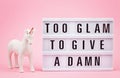 Lightbox with phrase Too glam to give a damn Royalty Free Stock Photo