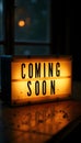Lightbox sign displaying coming soon message at night Royalty Free Stock Photo