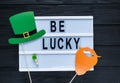 Lightbox with title Happy St Patricks Day on green background. Creative background to St. Patricks Day. Flat lay composition