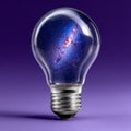 Lightbulb with galaxy inside on purple background. Royalty Free Stock Photo
