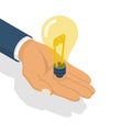 Lightbulb in hand isometric design