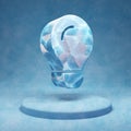 Lightbulb icon. Cracked blue Ice Lightbulb symbol on blue snow podium