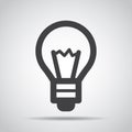 Lightbulb icon with shadow on a gray background. Vector illustration