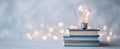 The Lightbulb Illuminating Ideas Above Stacked Books in a Soft Background AI generated image Royalty Free Stock Photo