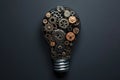 A lightbulb made of gears and cogs, illustrating the mechanics behind innovative ideas Royalty Free Stock Photo