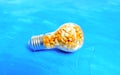 Lightbulb with raw and popped popcorn inside