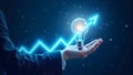 Lightbulb with Upward Arrow Held in Hands on Dark Background Suggesting Growth Royalty Free Stock Photo