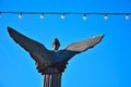 Lightbulbs and back of an Female angel sculpture