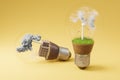 lightbulbs with minature wind turbine and coal-fired power station inside green soil and clouds pollution and smoke renewable