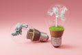 lightbulbs with minature wind turbine and coal-fired power station inside green soil and clouds pollution and smoke renewable