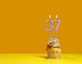 Lighted birthday candle - Celebration card with candle number 37