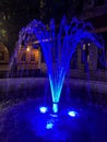 Lighted blue water fountain at nighttime Royalty Free Stock Photo