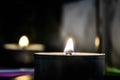 Lighted candle at dark room Royalty Free Stock Photo